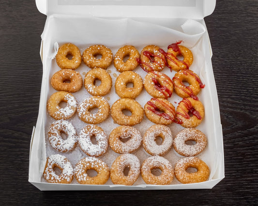 Two dozen mini donuts boxed and sealed for shipping